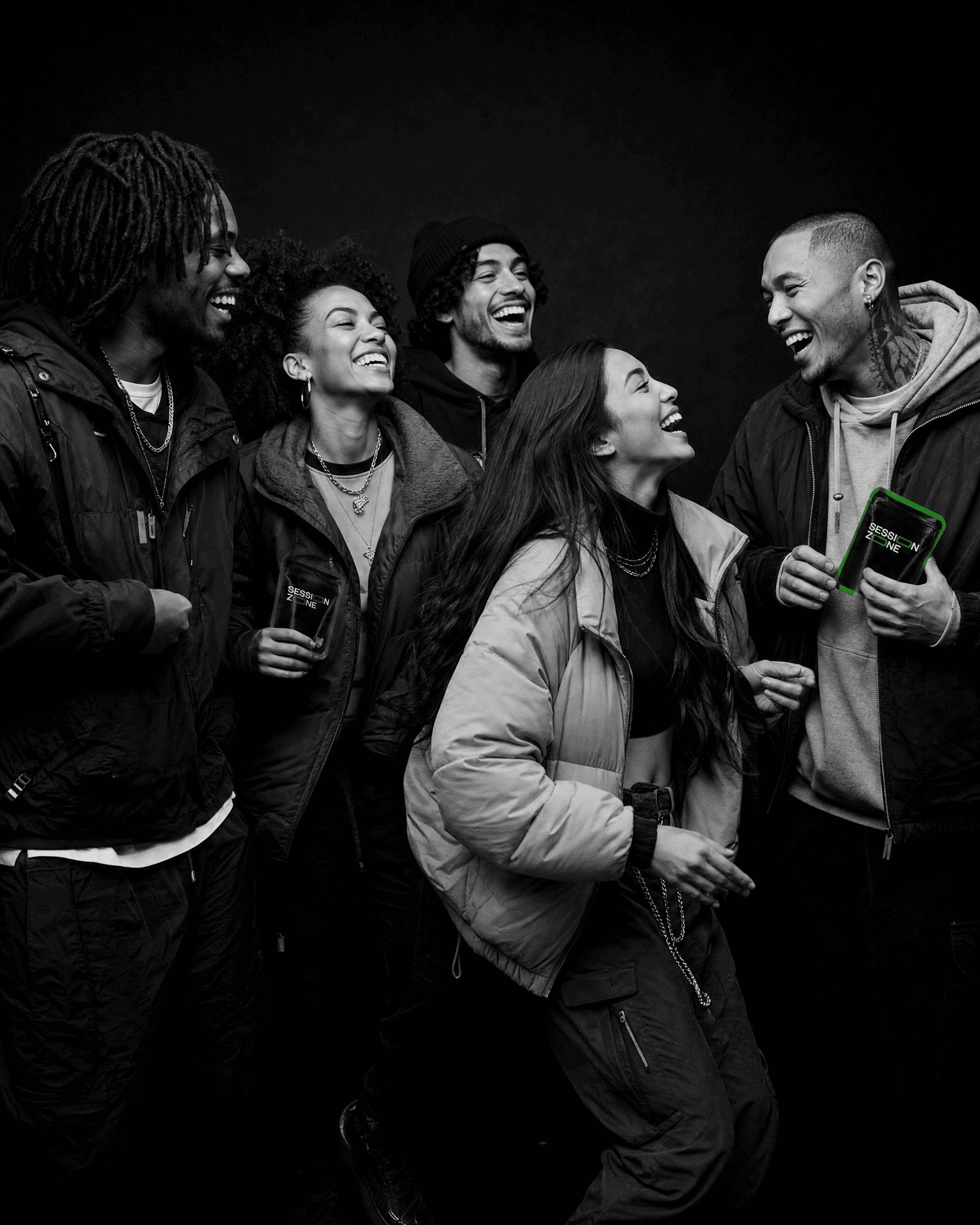 Diverse group of friends laughing together while holding green and purple Session Zone cannabis packages, representing cannabis culture, community, connection, and shared experiences.