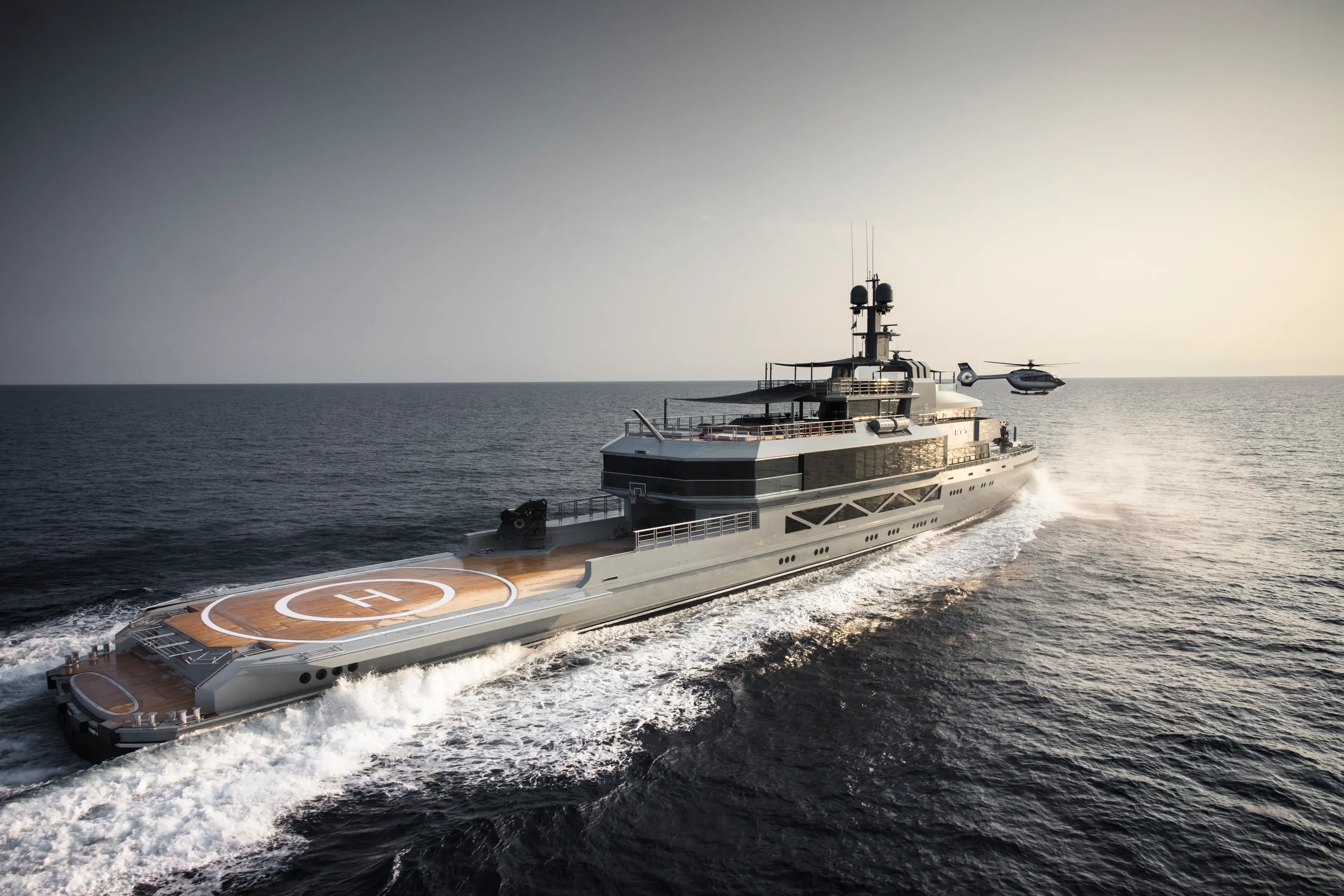 Minimal cream sofa set with cacti and skylight.