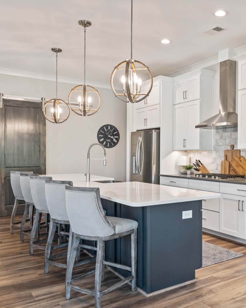 Close-up of a dark green leaf showing its textured surface and central vein against a muted background.