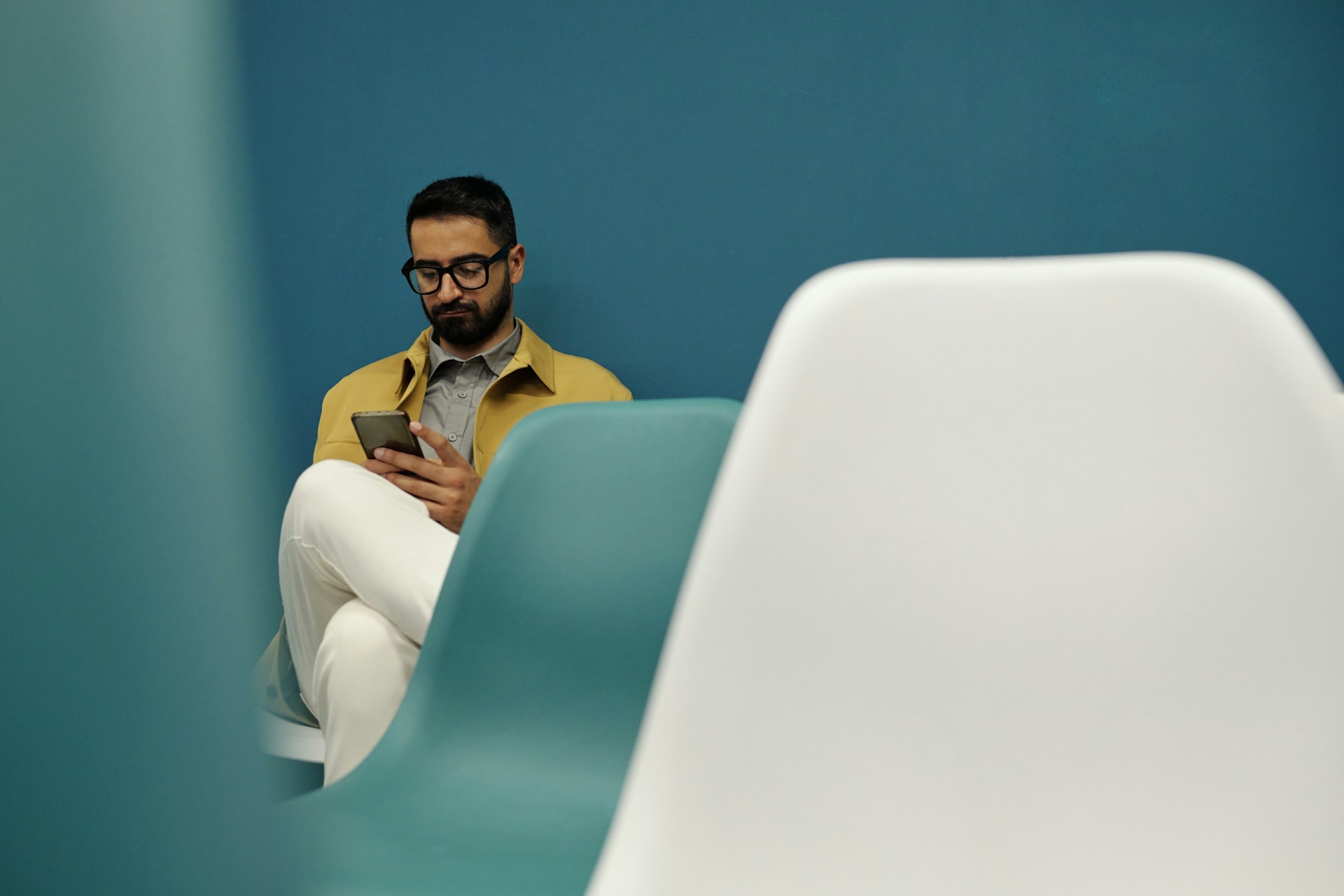 A person using a phone while sitting