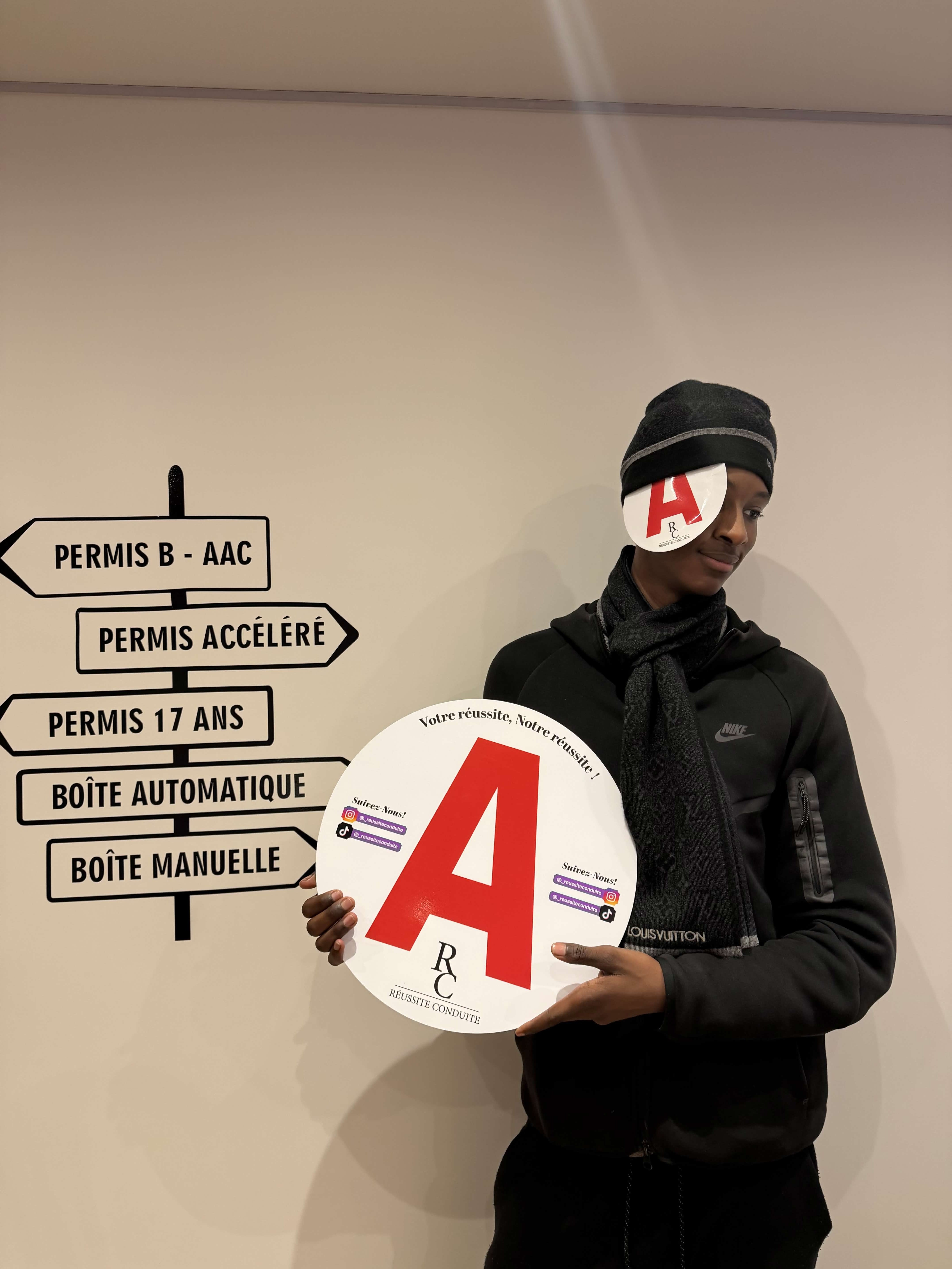 man in black jacket holding blue tablet computer