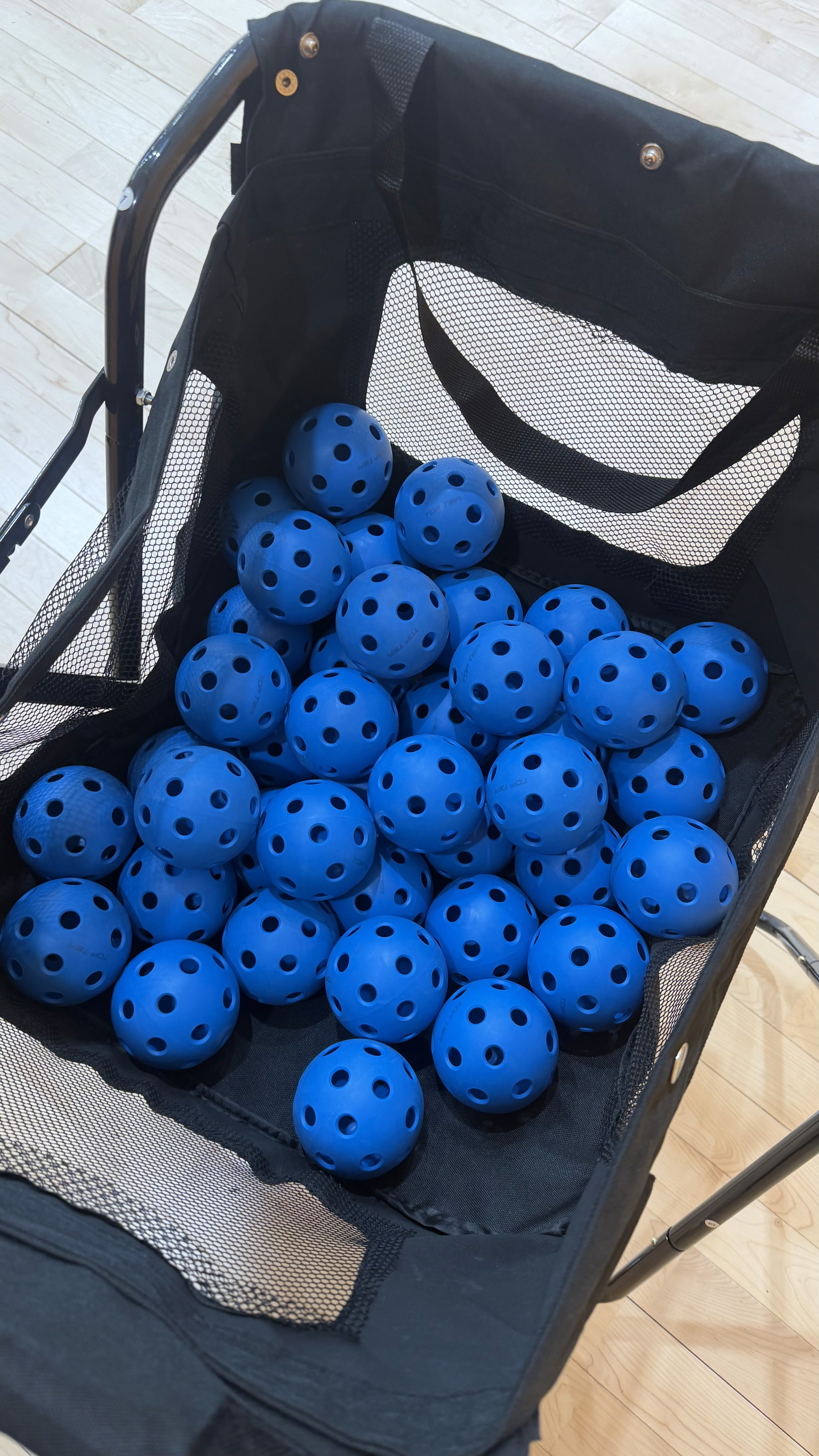 a person's feet with a ball on a purple carpet