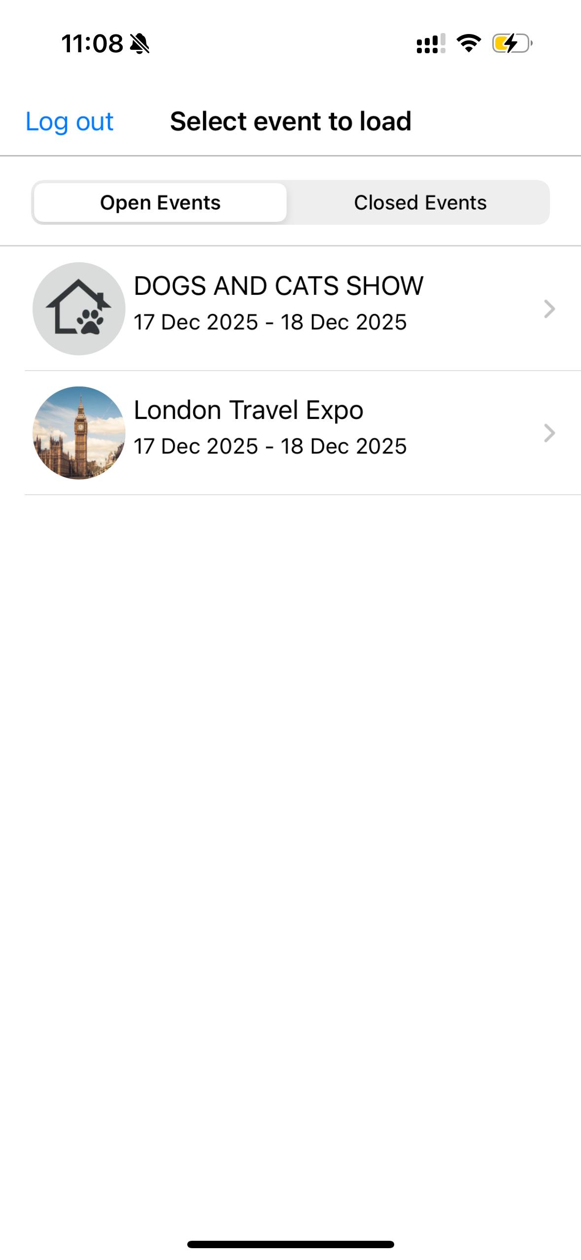 a hand holding a black device