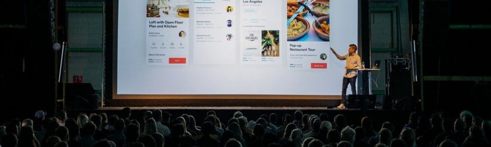 A man giving a presentation to an audience.