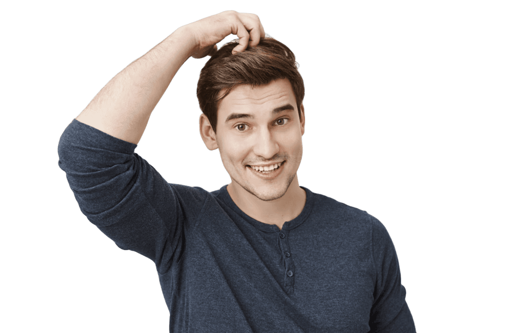Man with thick natural hair smiling after successful hair transplant procedure.