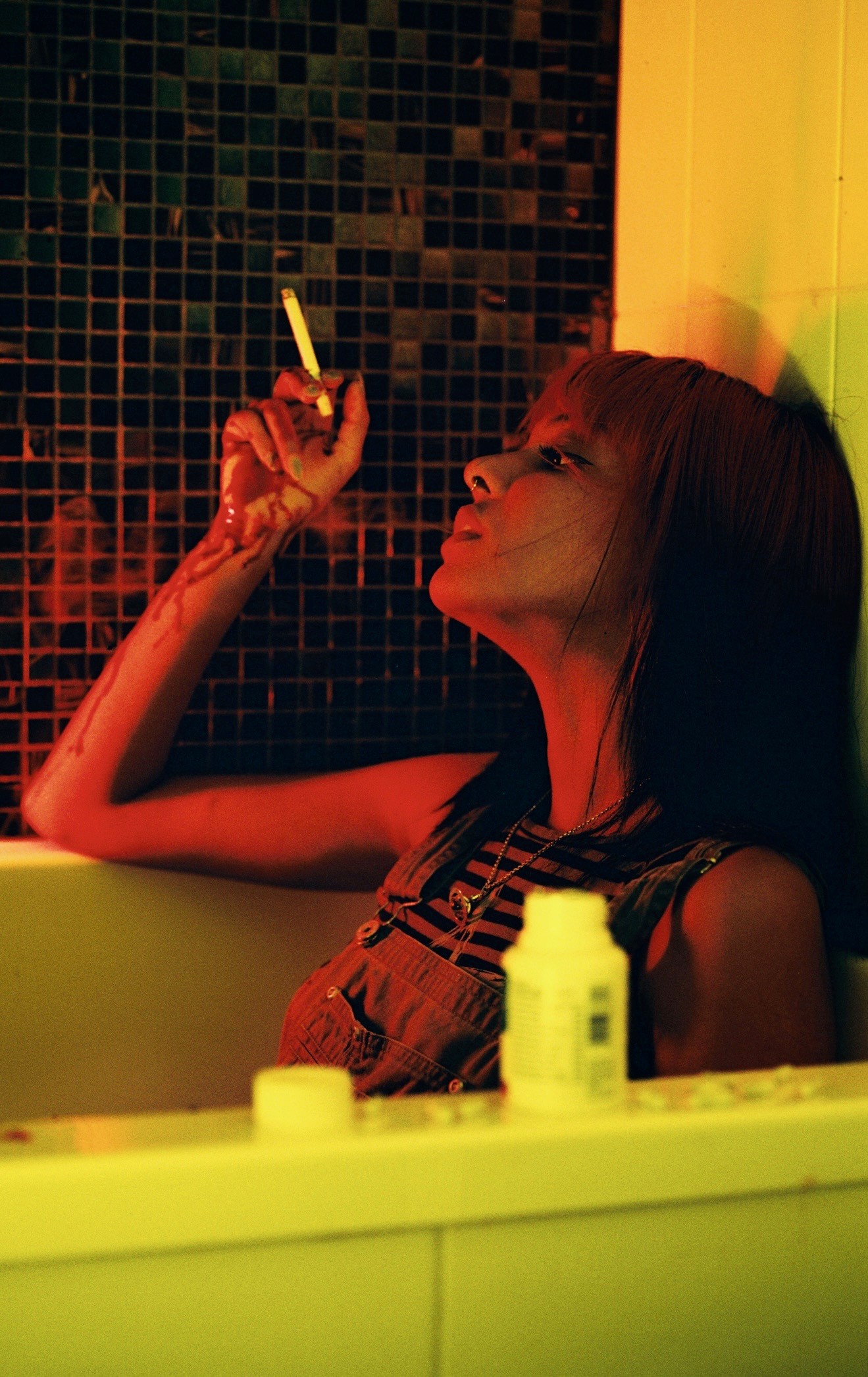 Person with light blue shirt looks to his right side