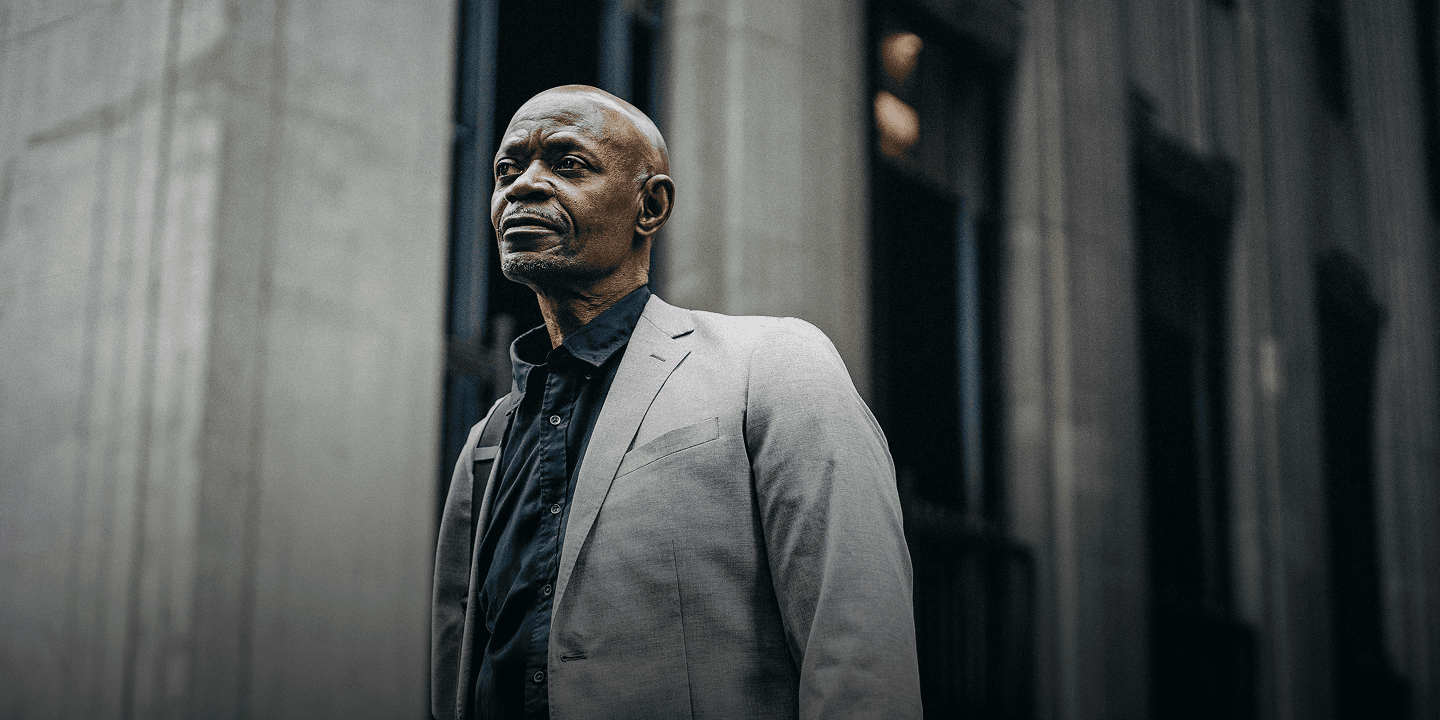 Middle aged man holding a folder