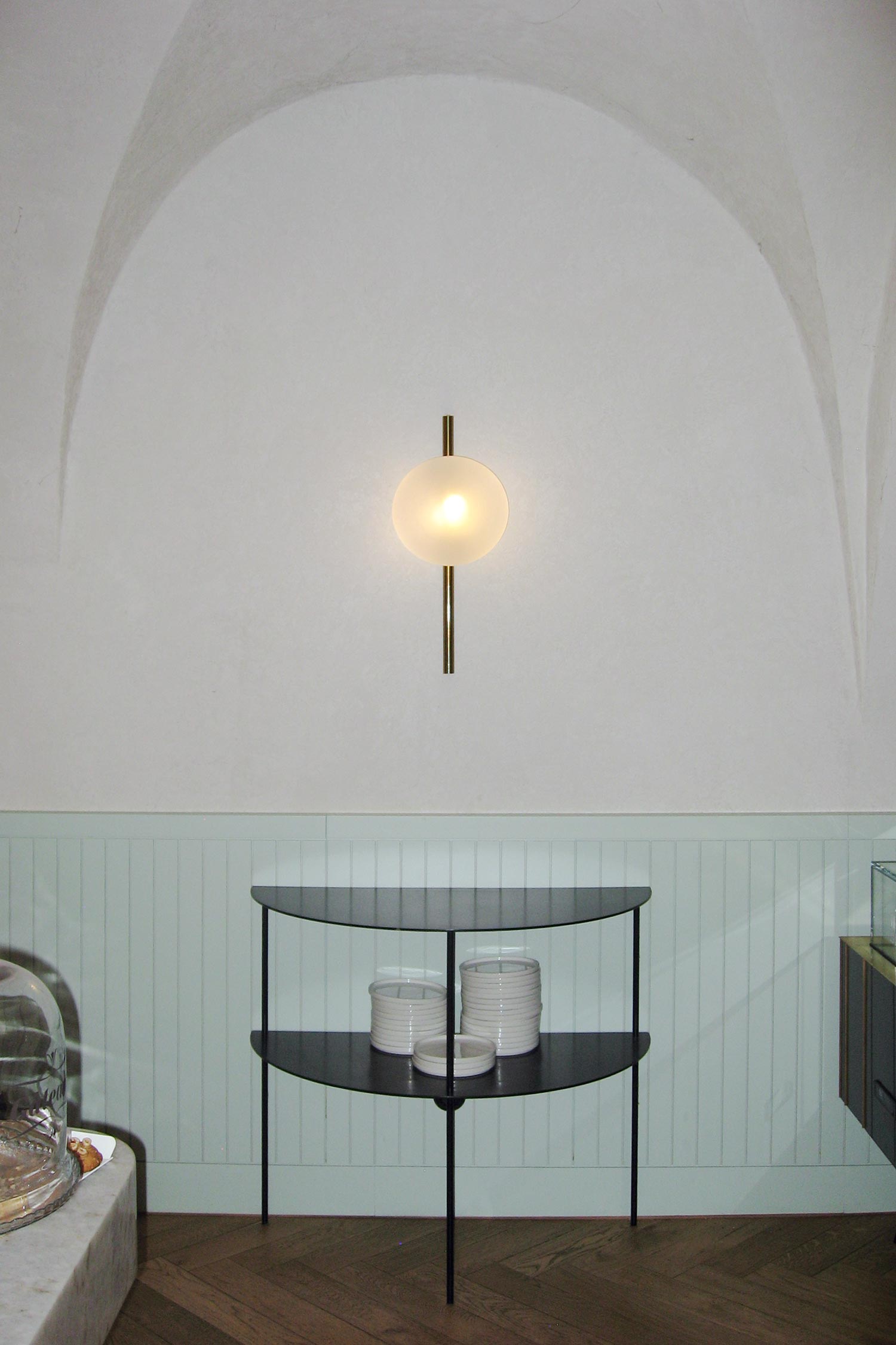 Luna I01 wall luminaire mounted on wall with diffused light and minimal structure by Jiri Krejcirik