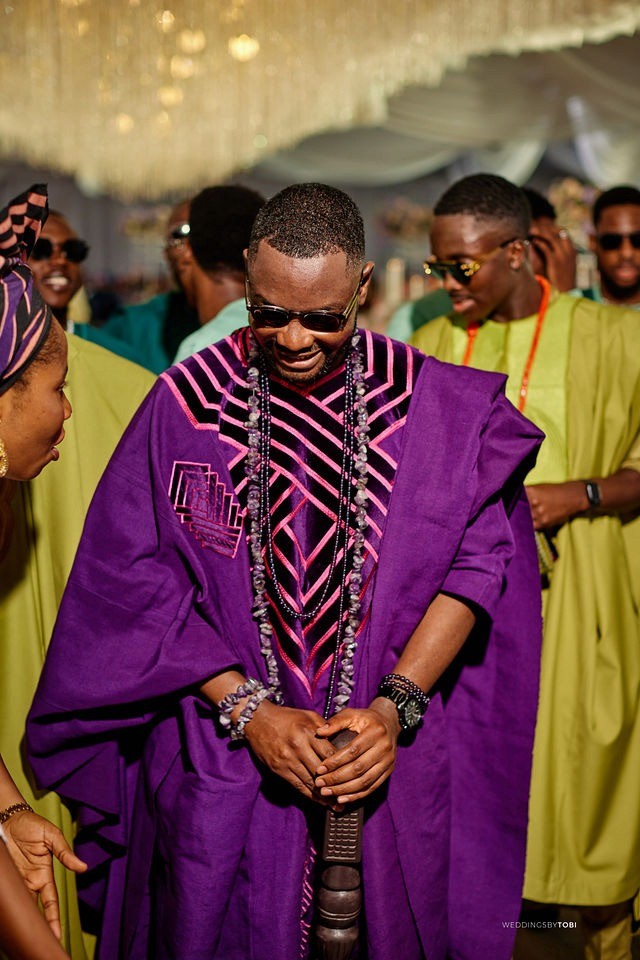Groom and Bride happy with family and friends. Luxury wedding planned by Victoria Brooks Events in Nigeria with elegant décor and beautiful reception