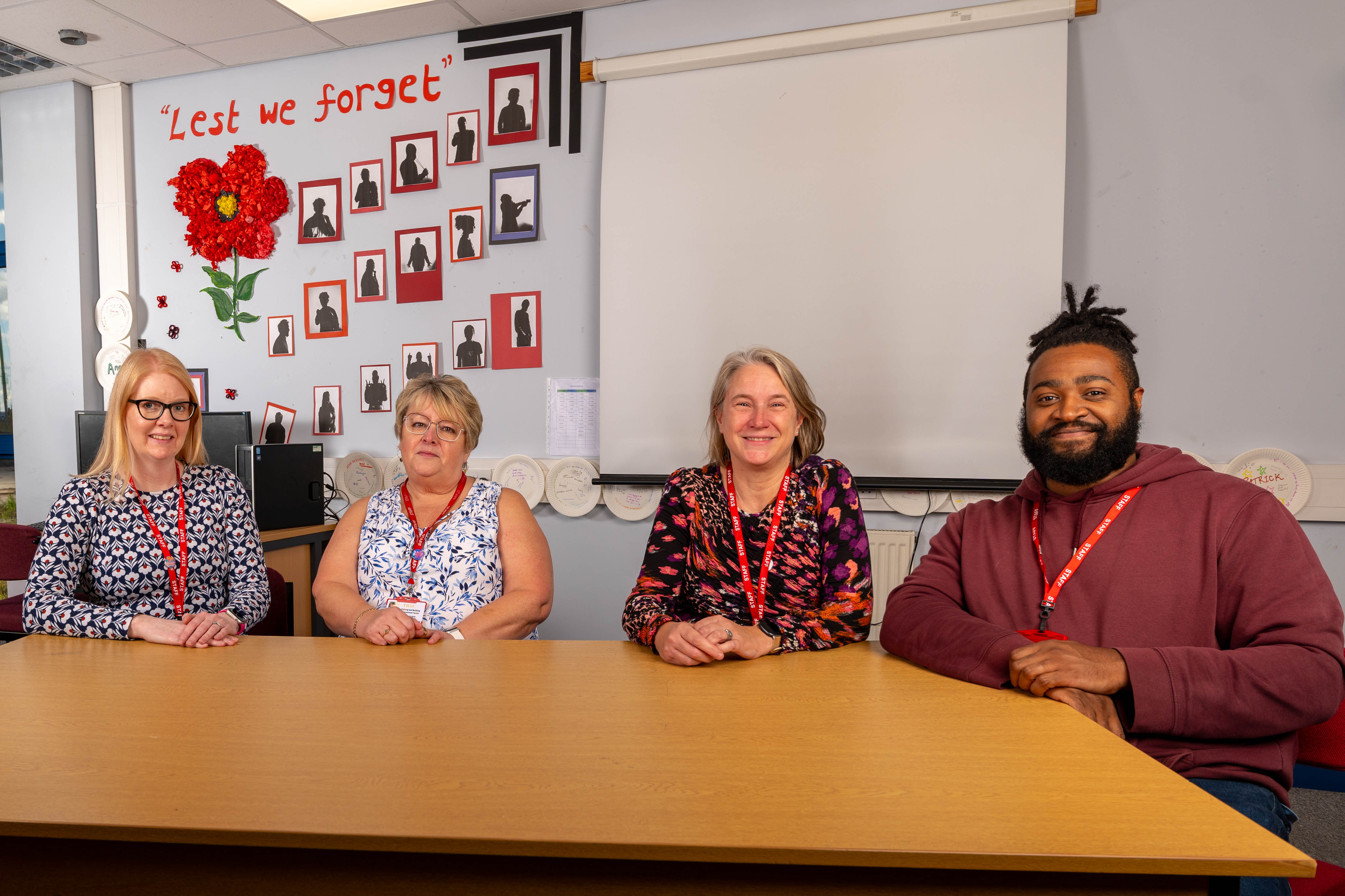 Photo of the centre's team, smiling and posing together, showcasing an atmosphere of collaboration and commitment