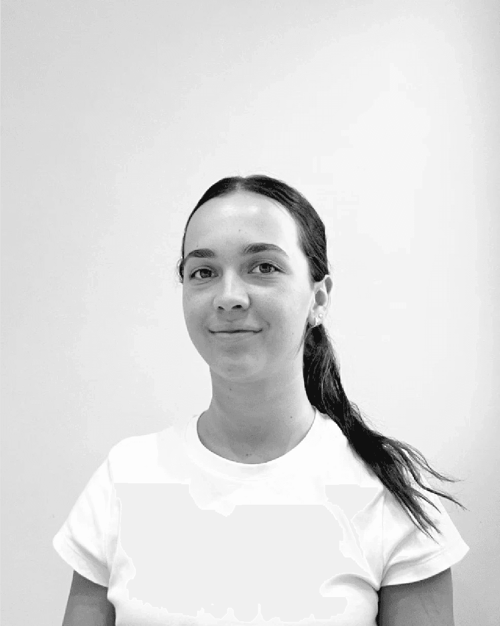 a blurry photo of a woman in a white shirt