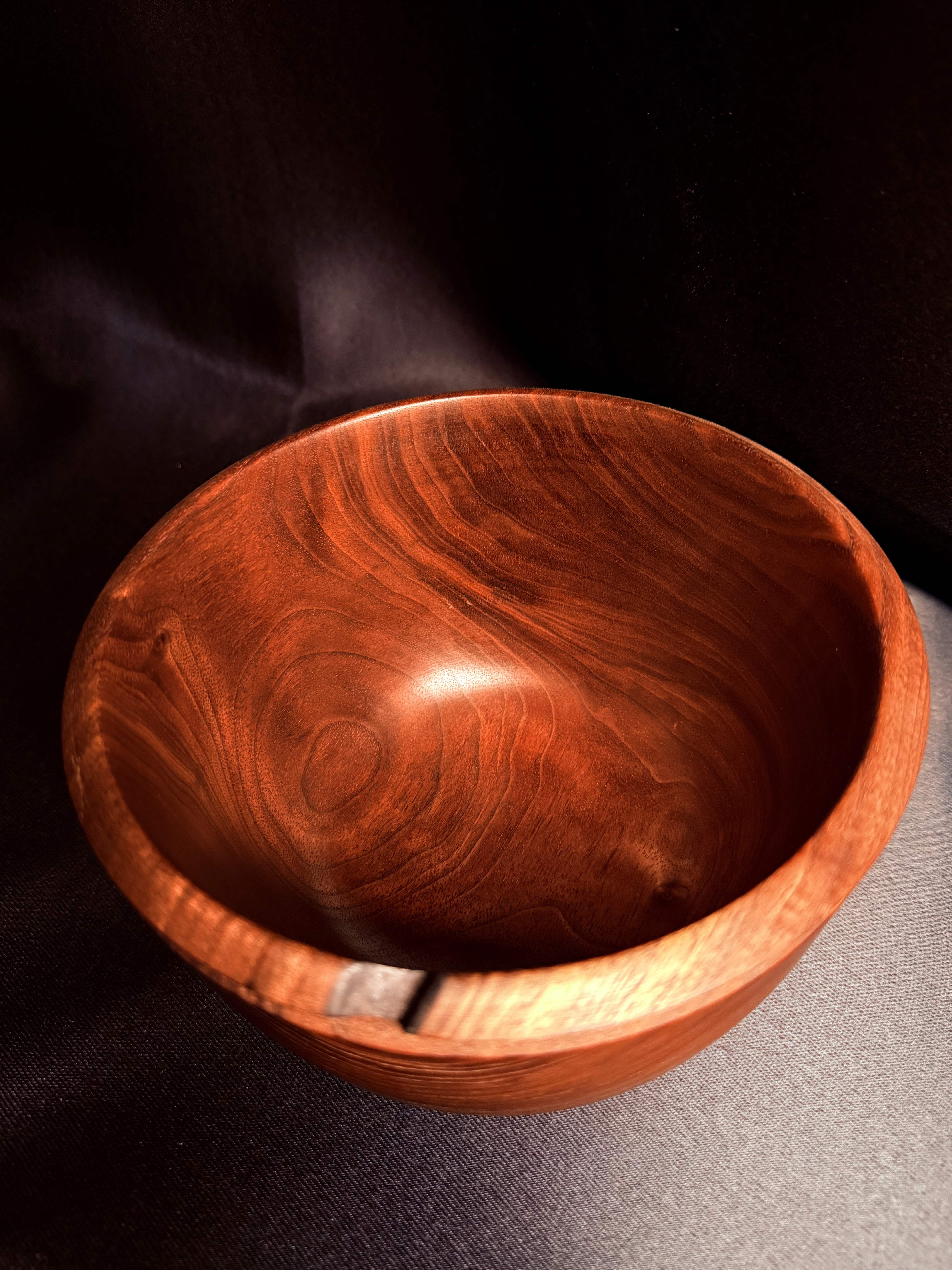 Alternate view of the Fire-Scarred Walnut Bowl, showing its hand-turned form.