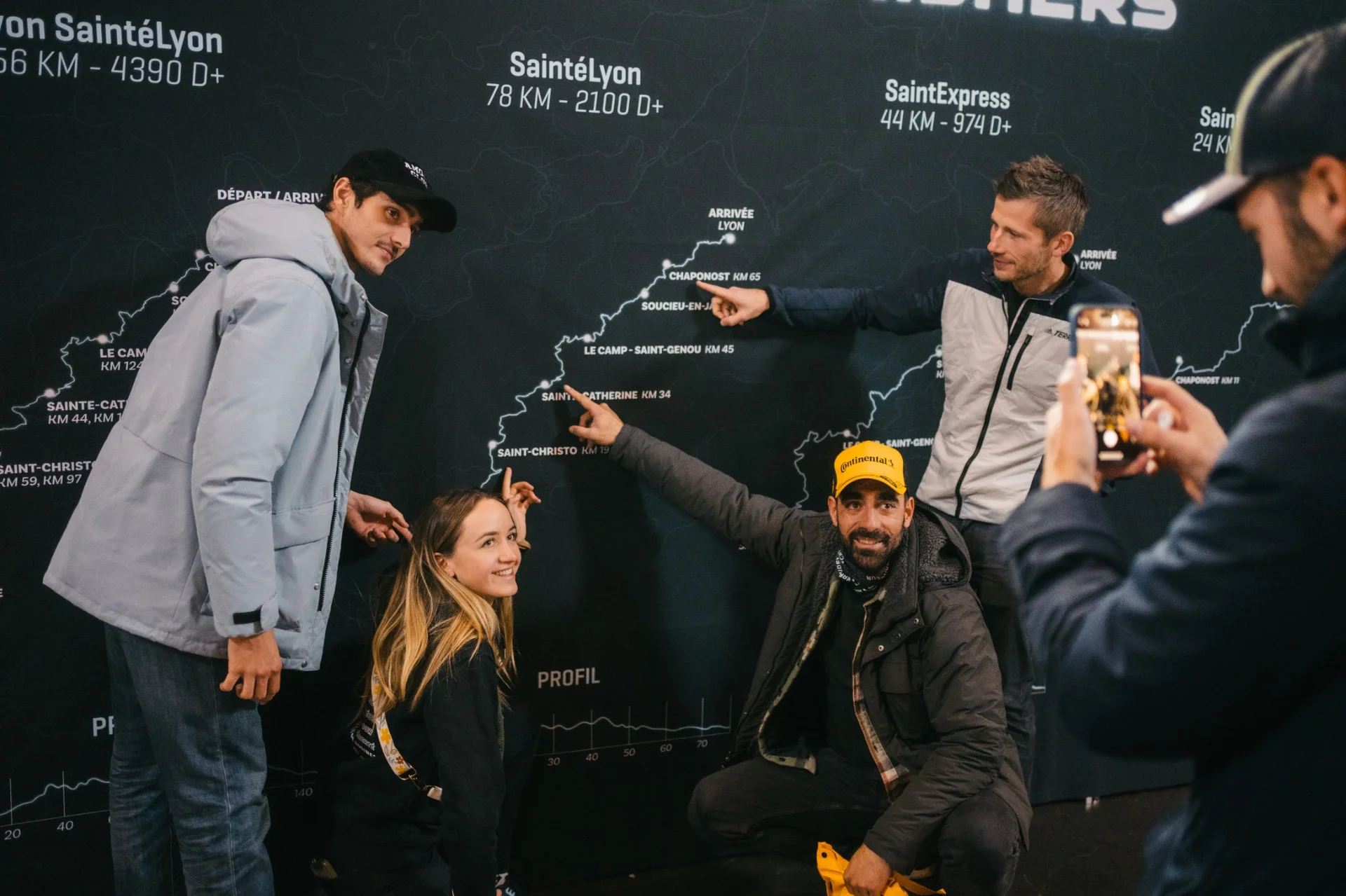 Team photo in front of the course map