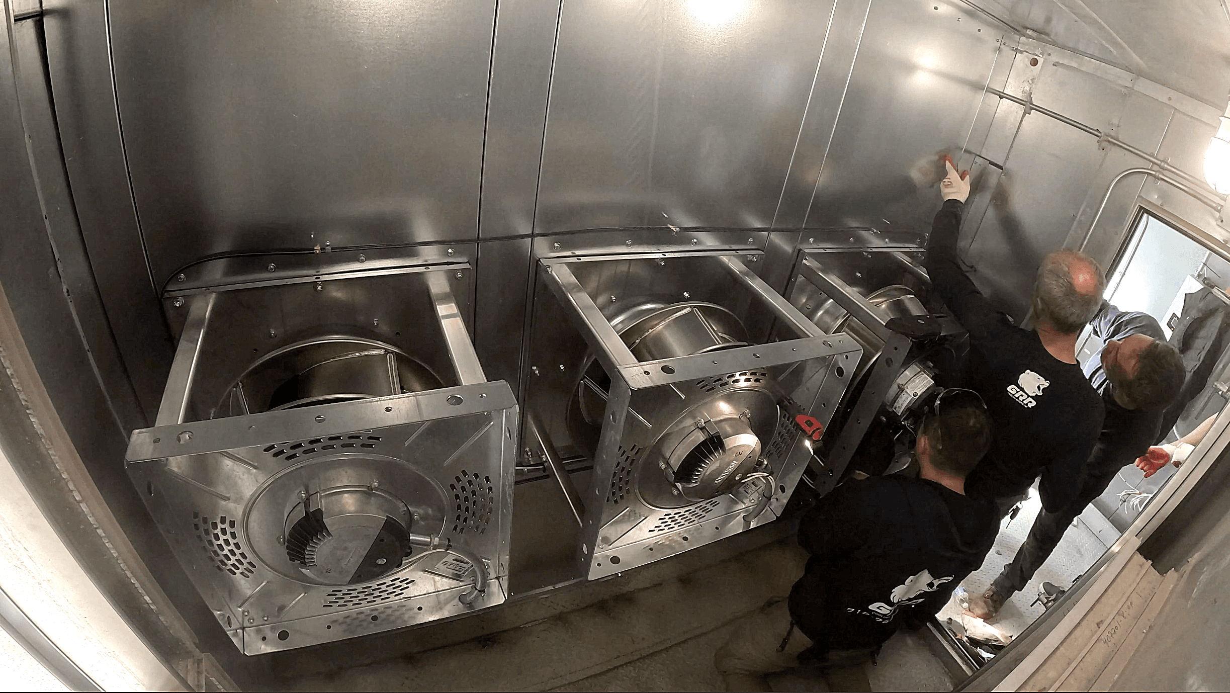 C fan array installed inside a hospital air handling unit following retrofit by GRR Cooling Experts.