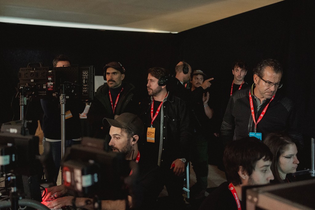 The crew watching the monitors in video village on the For Everybody set