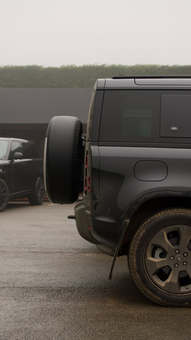 A Land Rover driving across the picturesque grounds, showcasing the seamless blend of outdoor adventure and luxury hospitality that Raisthorpe Flyers offers.