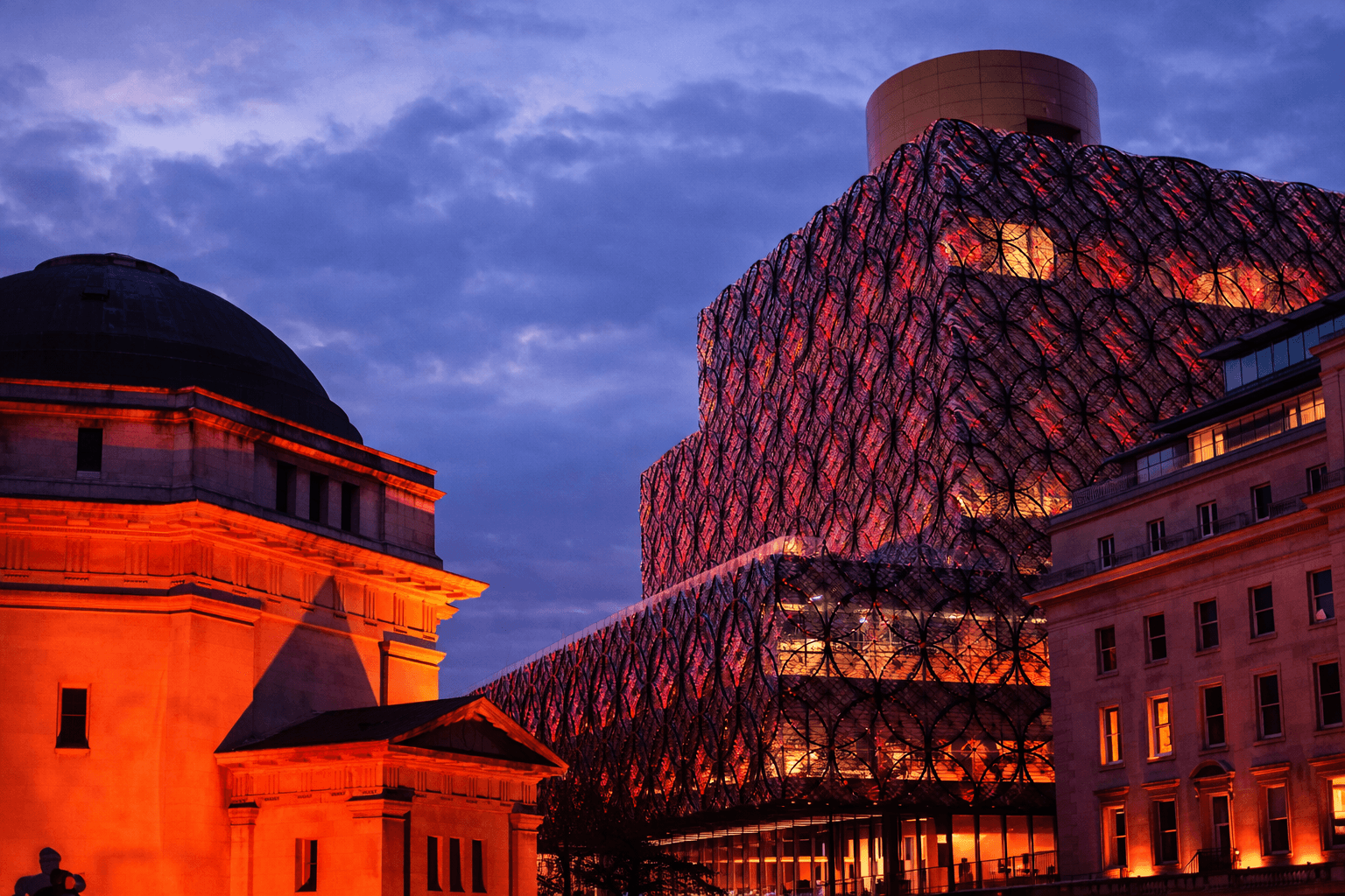 Birmingham UK city skyline featuring the Library of Birmingham and historic architecture at sunset representing digital marketing and business growth in Birmingham