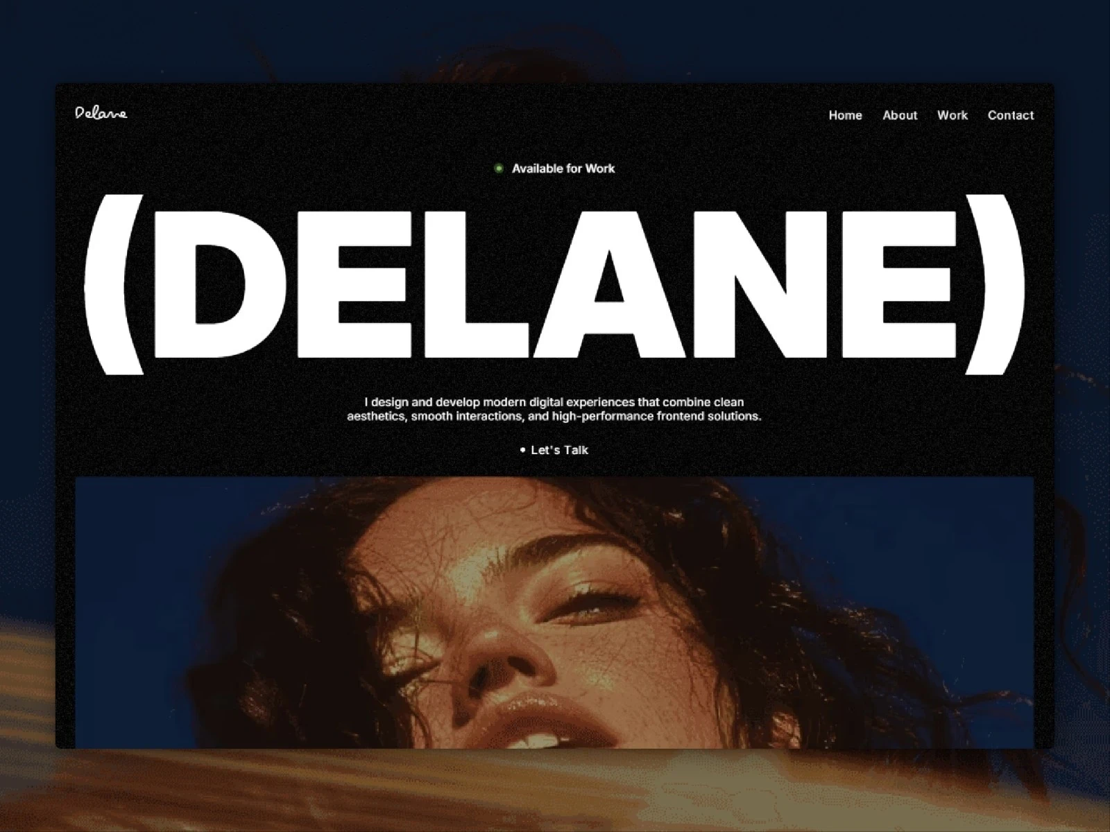DELANE minimal portfolio homepage with oversized typography and editorial portrait