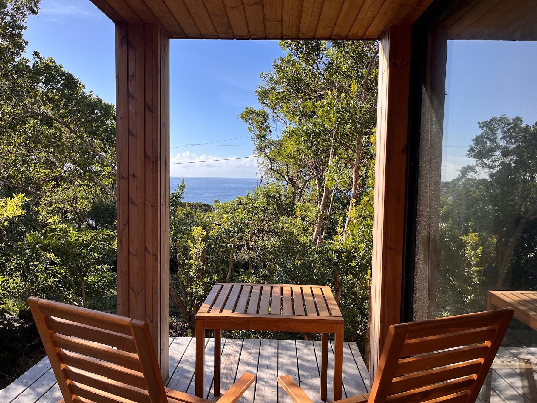 Deck with ocean view and table
