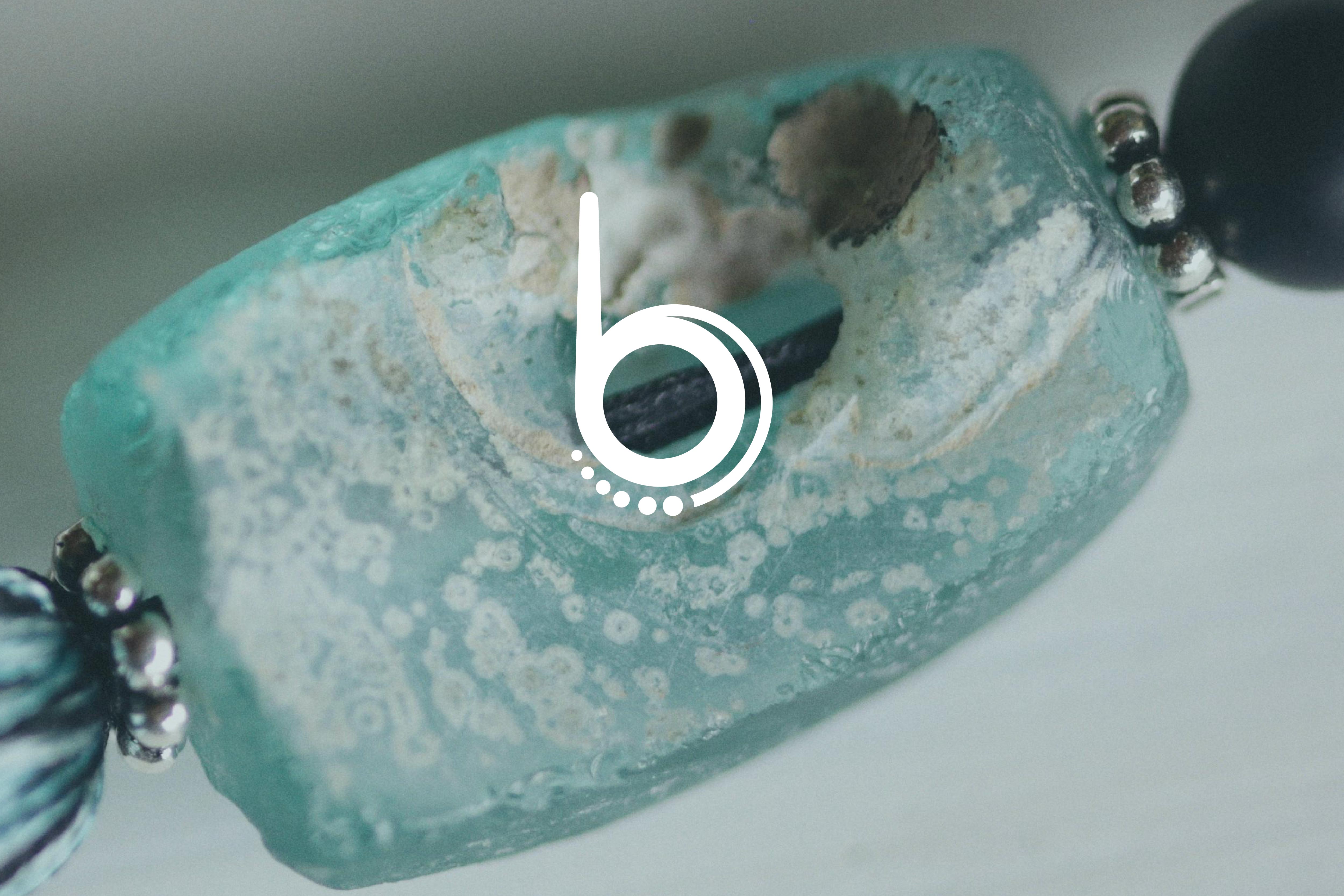 Batch.Works logo over a photo of a box of 3D printed objects