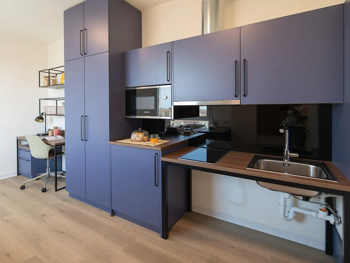Fully fitted student studio kitchen in Bologna with induction hob, oven and Bosch microwave