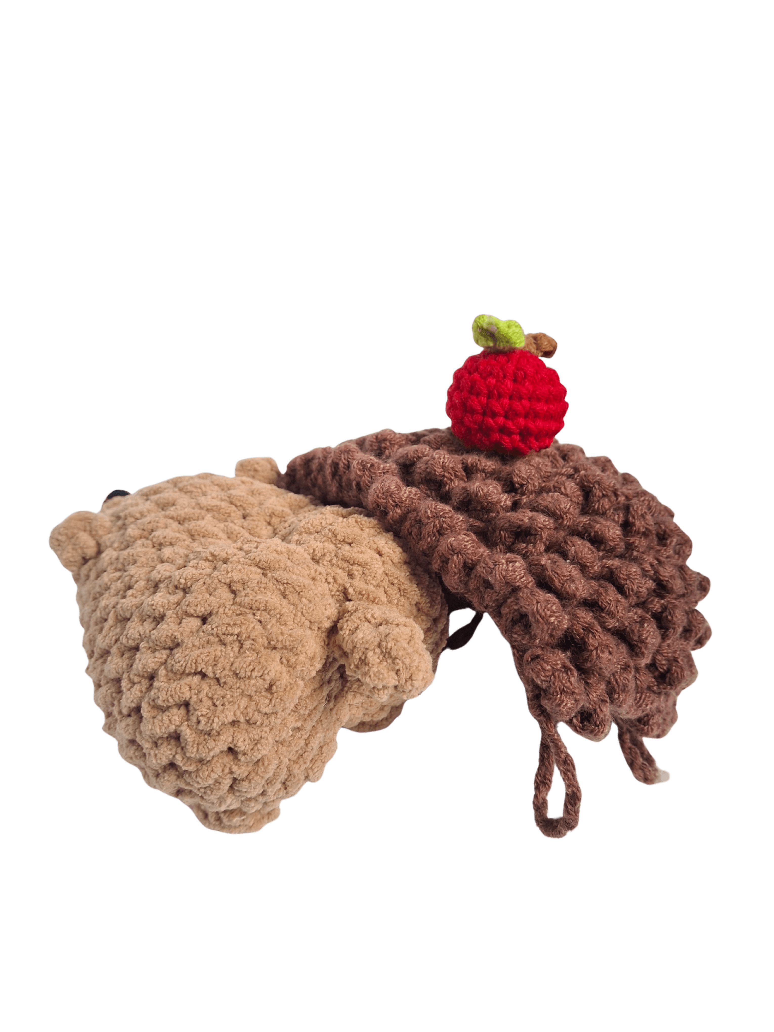 A handcrafted knitted hedgehog toy featuring a soft cream-colored body and intricately detailed, textured brown spines, perfect for children and collectors.