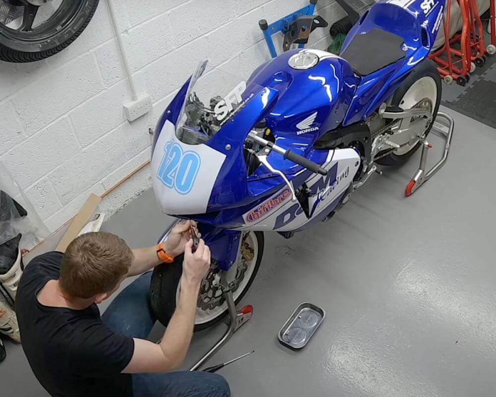 Ollie Moto carrying out maintenance on his CBR600RR track bike.