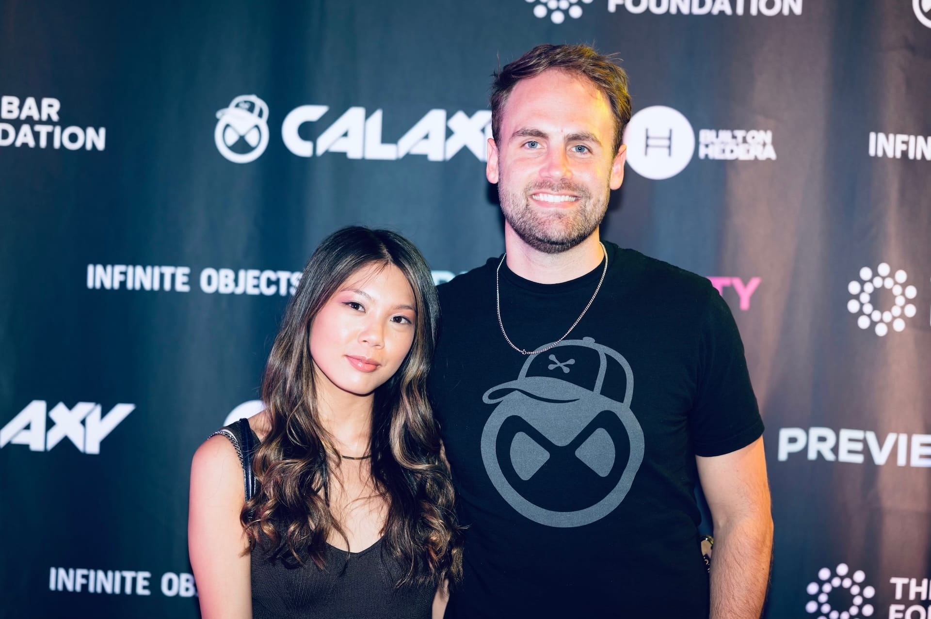 Designer Chadd Weston posing with his fiance, Lorinda at a penthouse party during NFT.NYC conference in New York