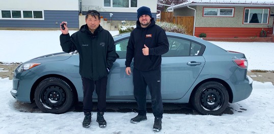 happy customer holding car key