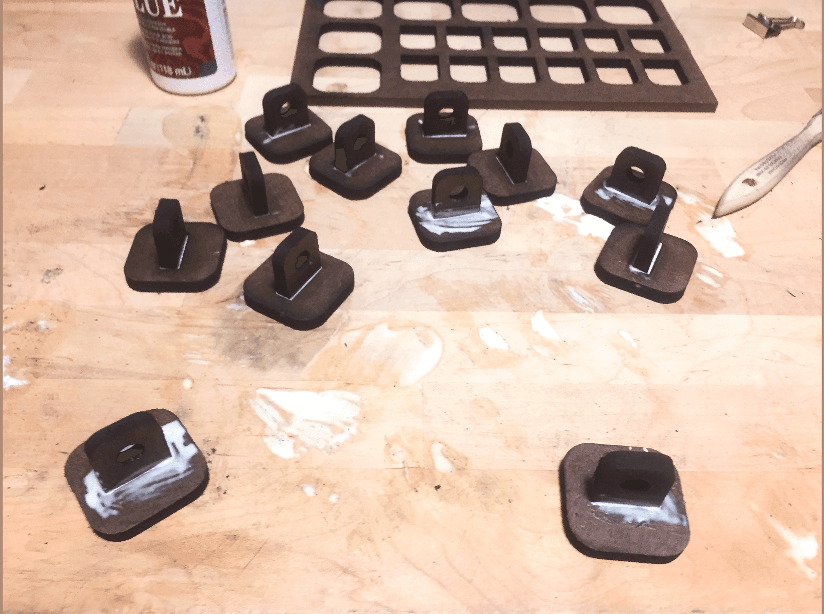 Token laying on a table, glue marks.