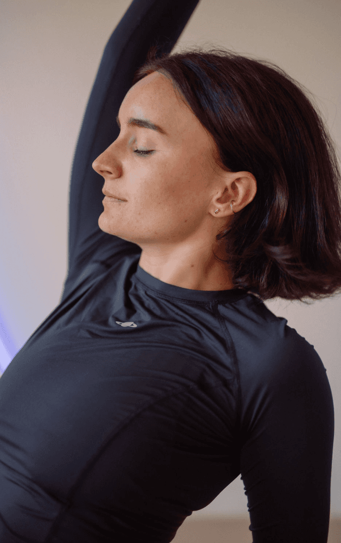 Black cosmetic product bottle against a dark background