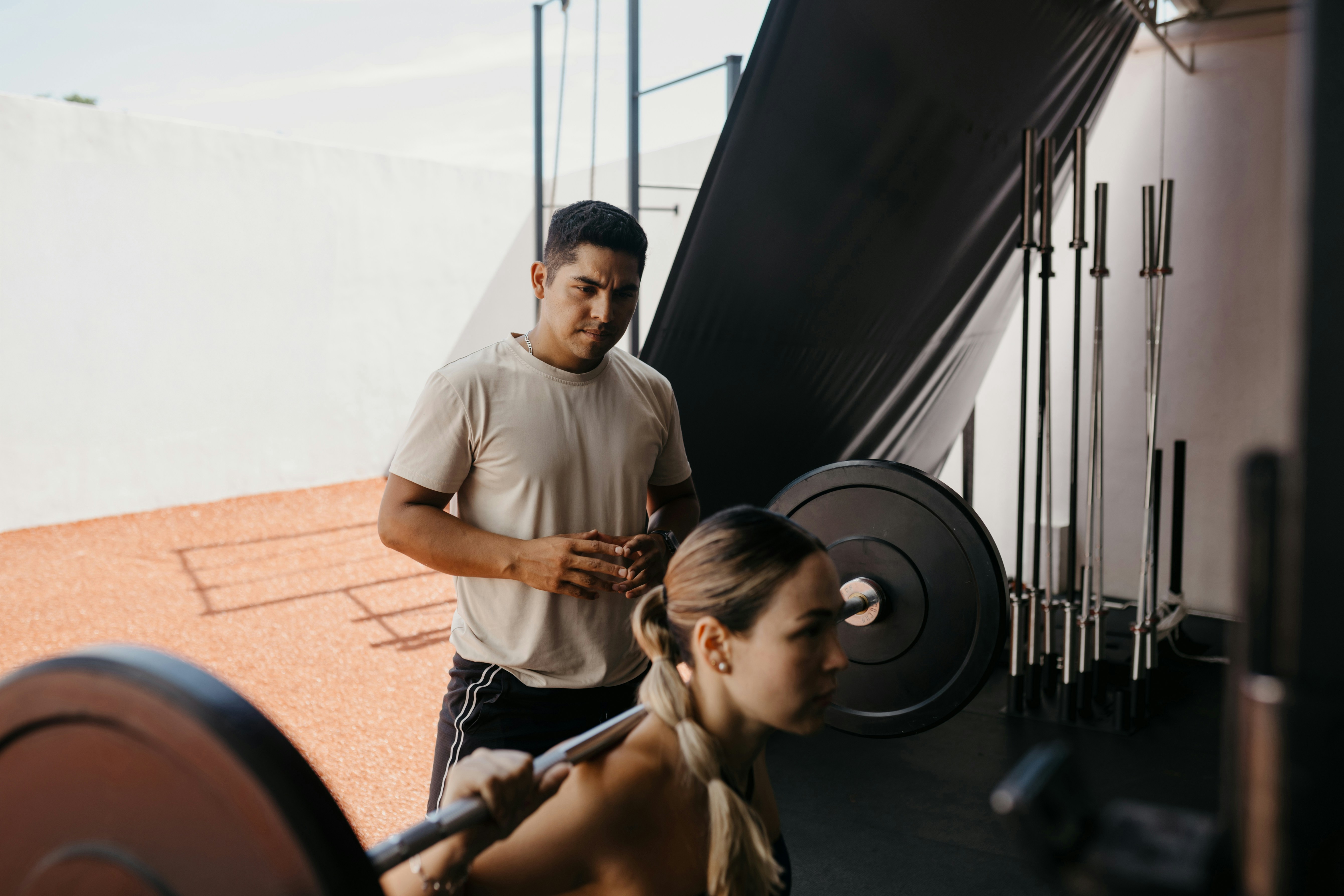 Personal trainer in outside gym