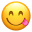 Un emoji jaune avec des yeux fermés, un grand sourire et une langue rose qui sort sur le côté.