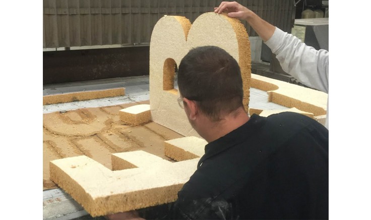 Ecovative employees constructing the SynBioBeta stage letters (source: Ecovative)