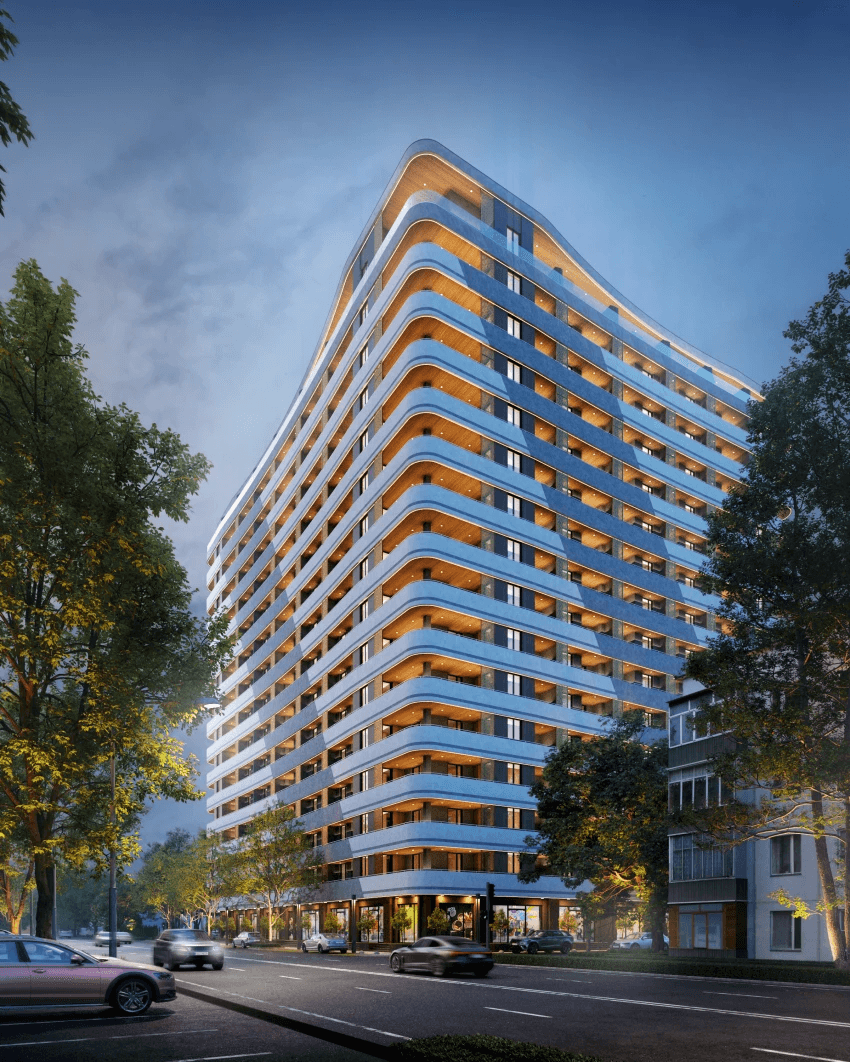 Close-up of a dark green leaf showing its textured surface and central vein against a muted background.
