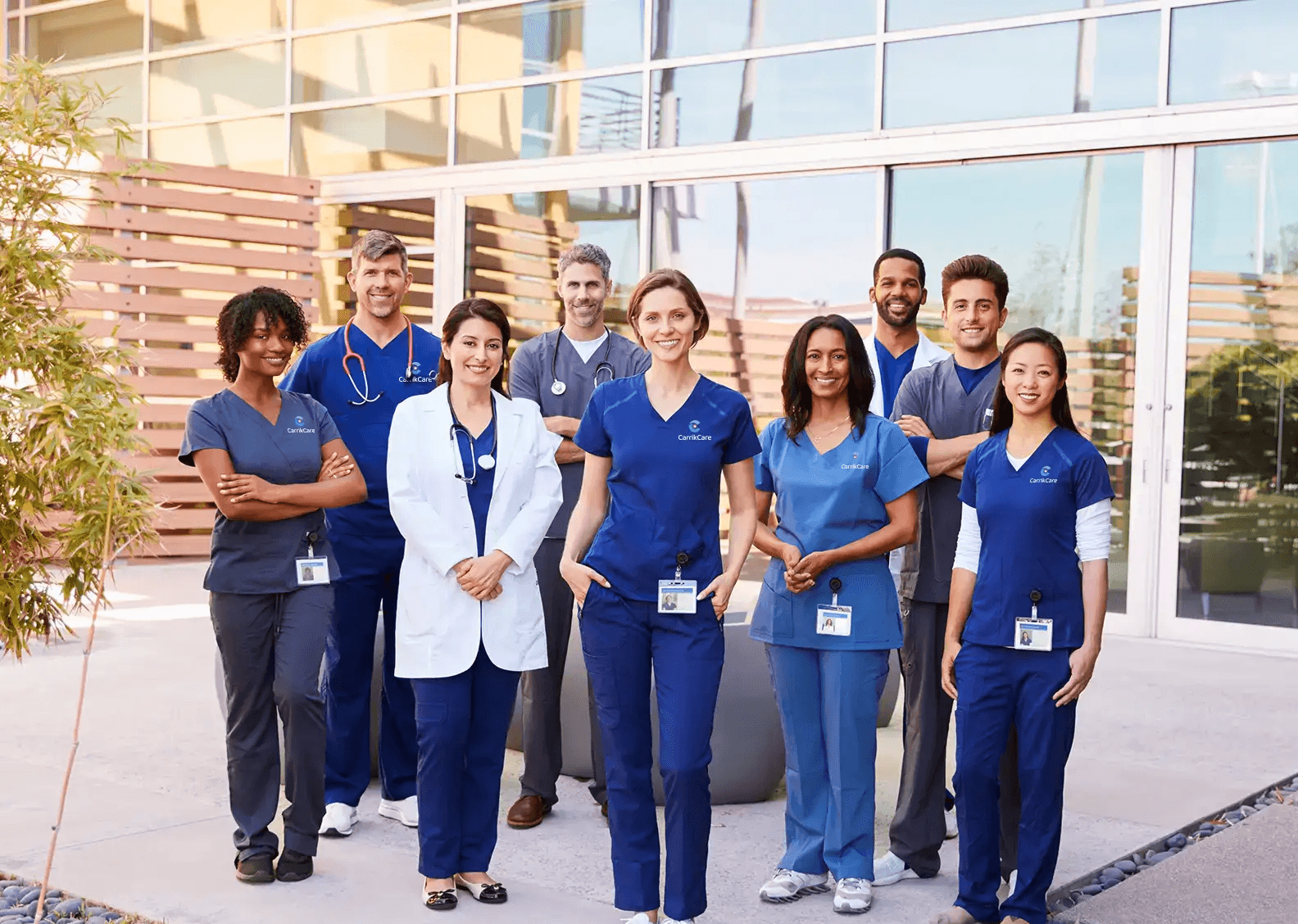 Group of diverse healthcare professionals smiling outdoors