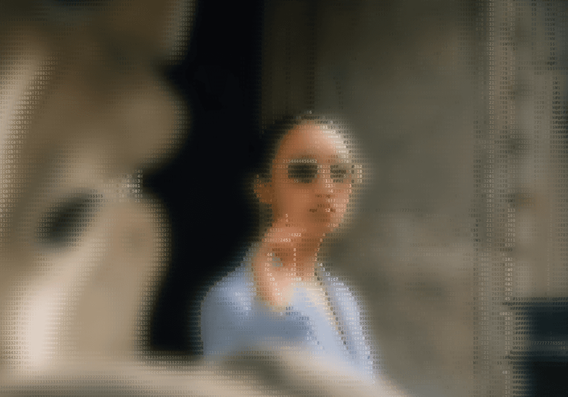 Woman in sunglasses pointing, soft focus.  Outdoor portrait. 