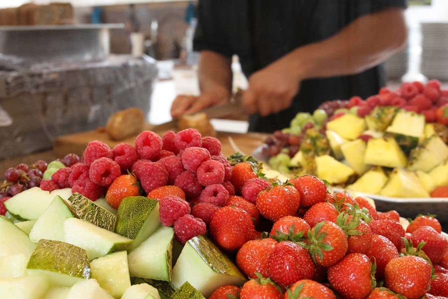 husband and wife working happily on a laptop