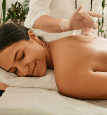 woman in black tank top holding white textile