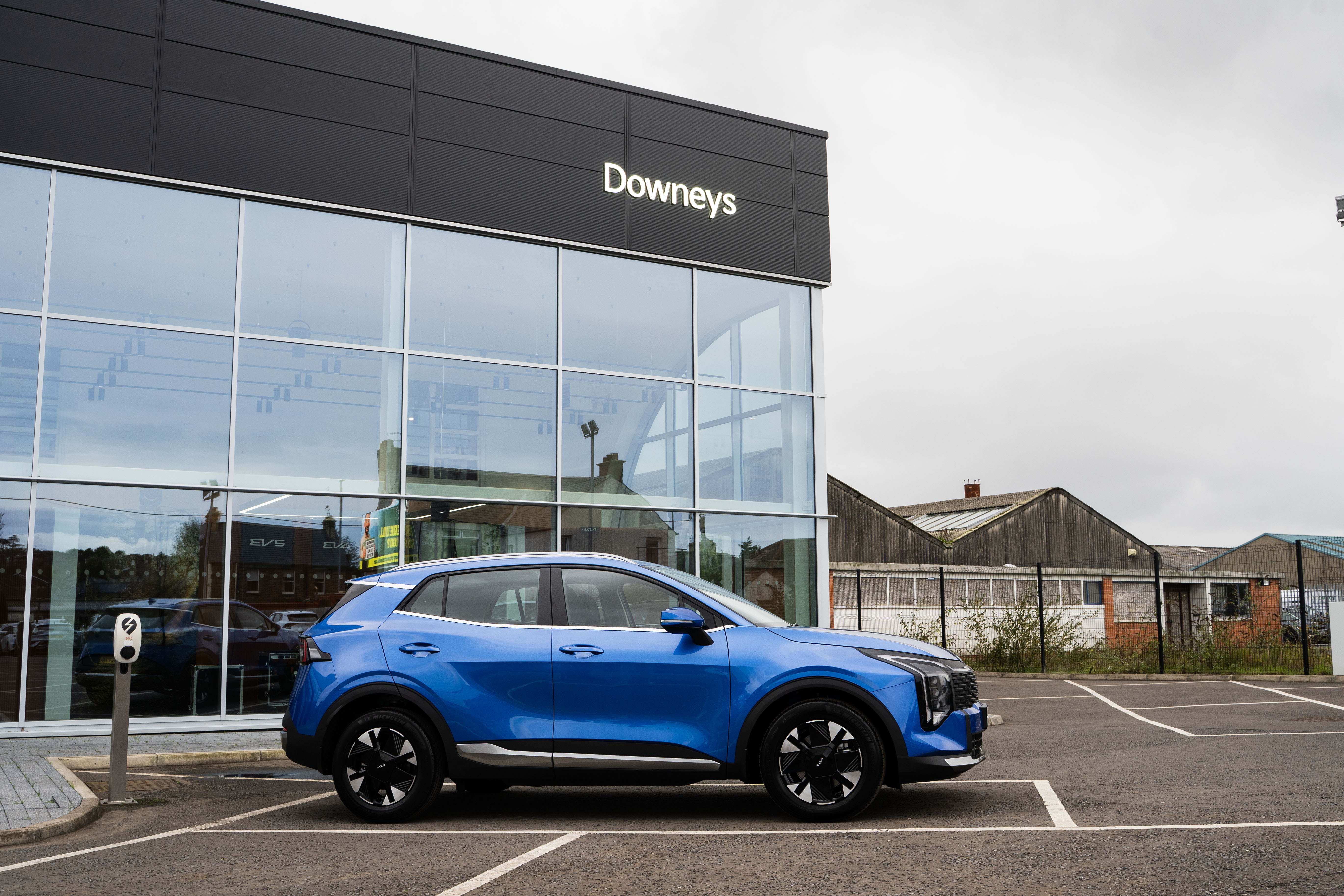 a group of people standing around a camera set up