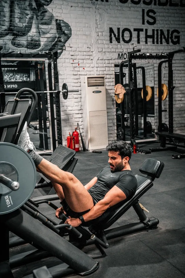 Person holding an open notebook while wearing a blood pressure cuff
