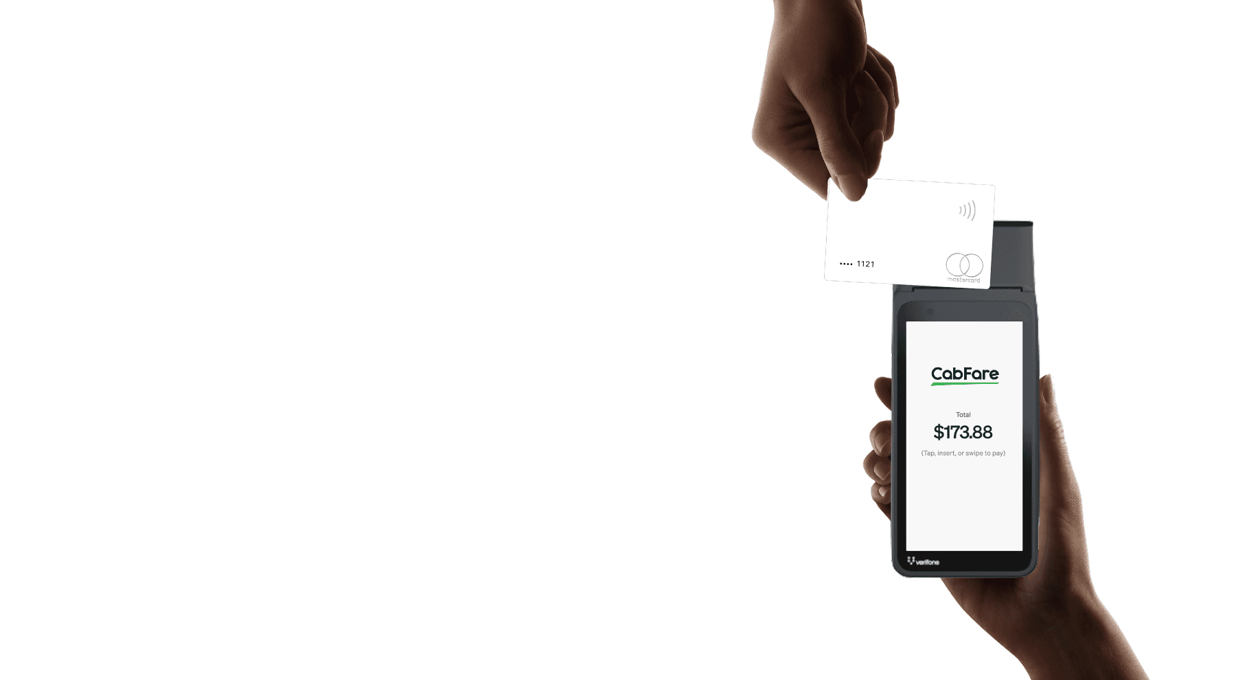 A man driving a car. He is wearing a grey sweater and is looking at the camera with a slight smile.