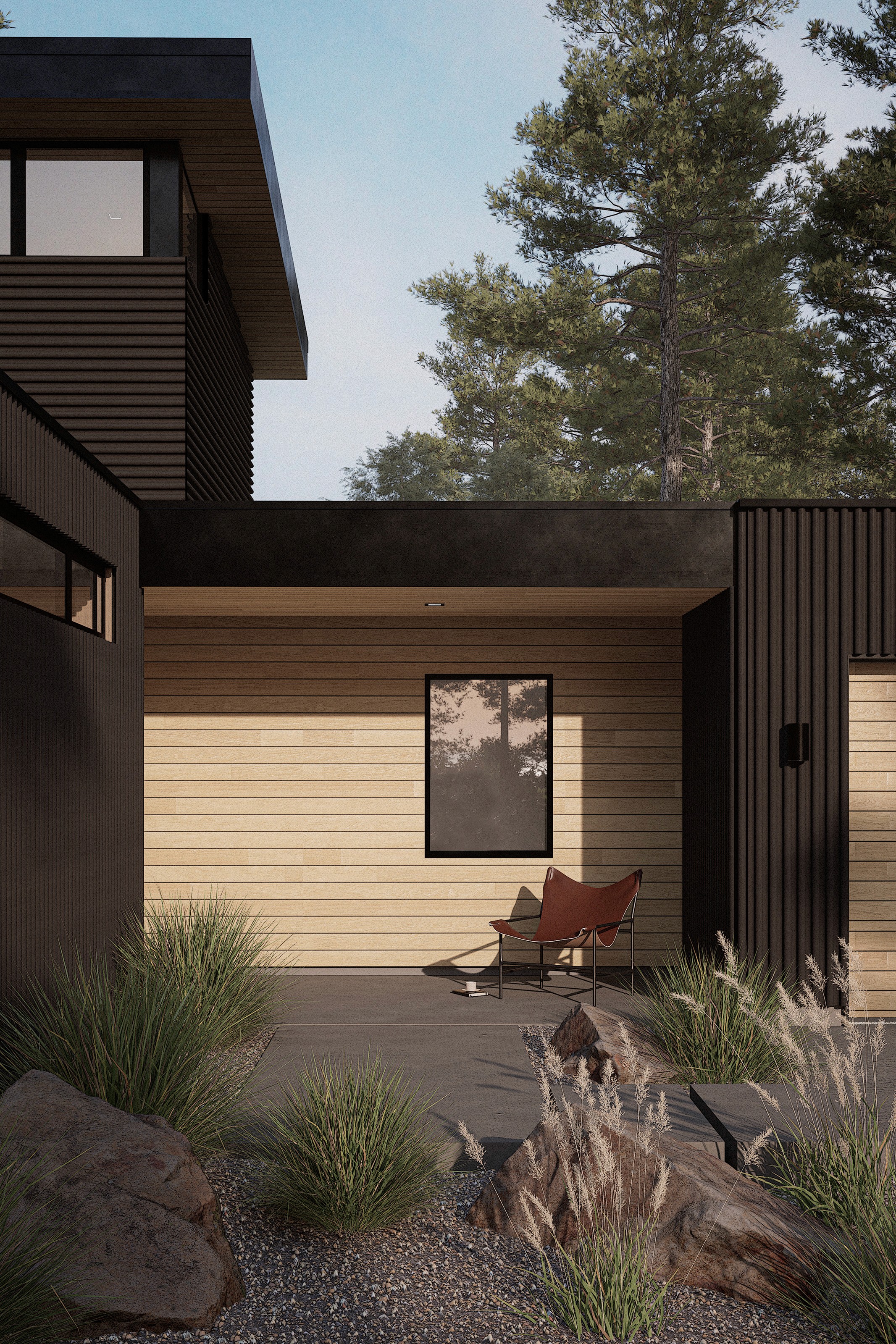 Exterior view of a light wood clad entry porch embeded into the black metal sided home with native plantings and path.