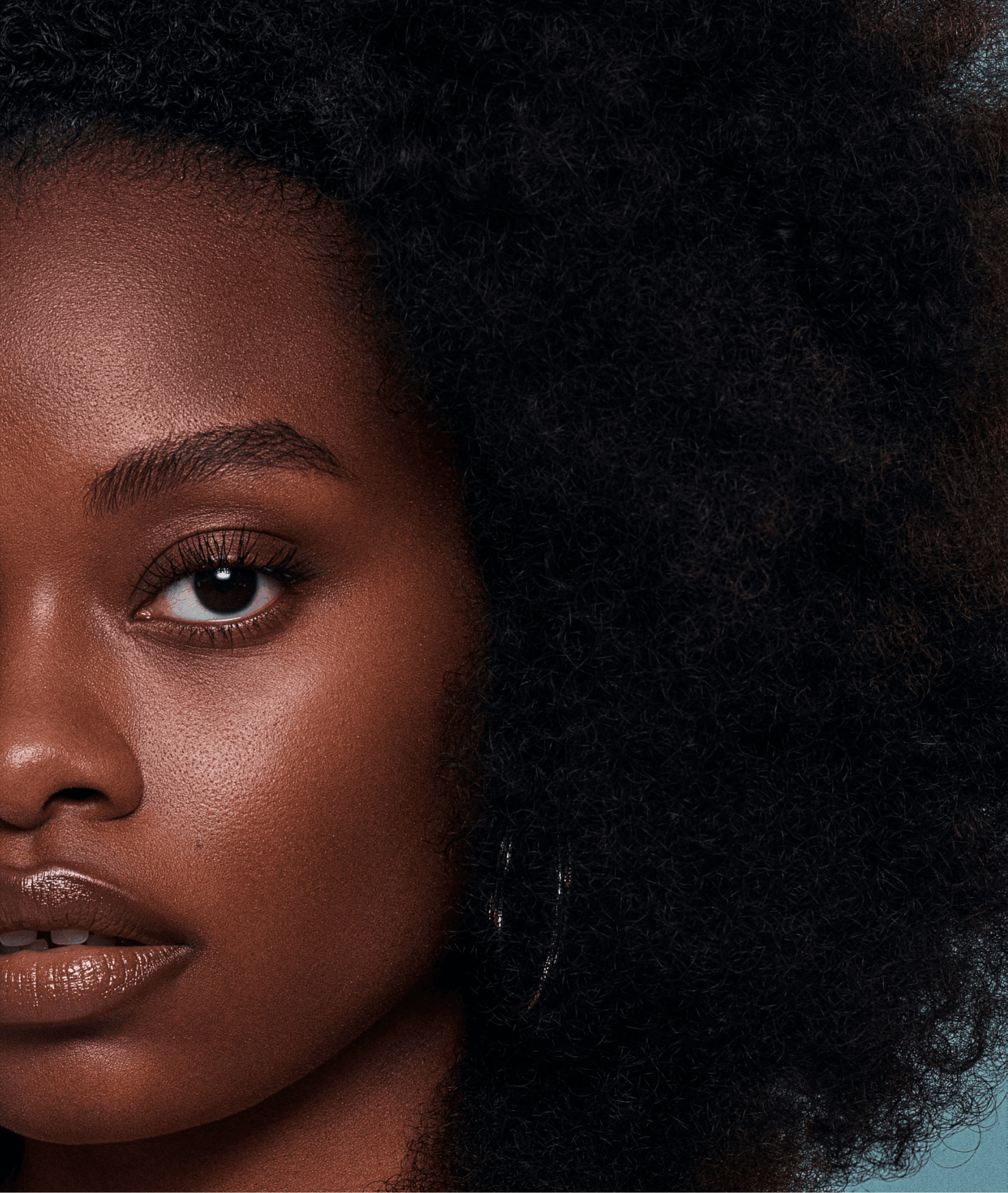 Close-up campaign portrait of model with natural afro hair for Grow-Good Beauty