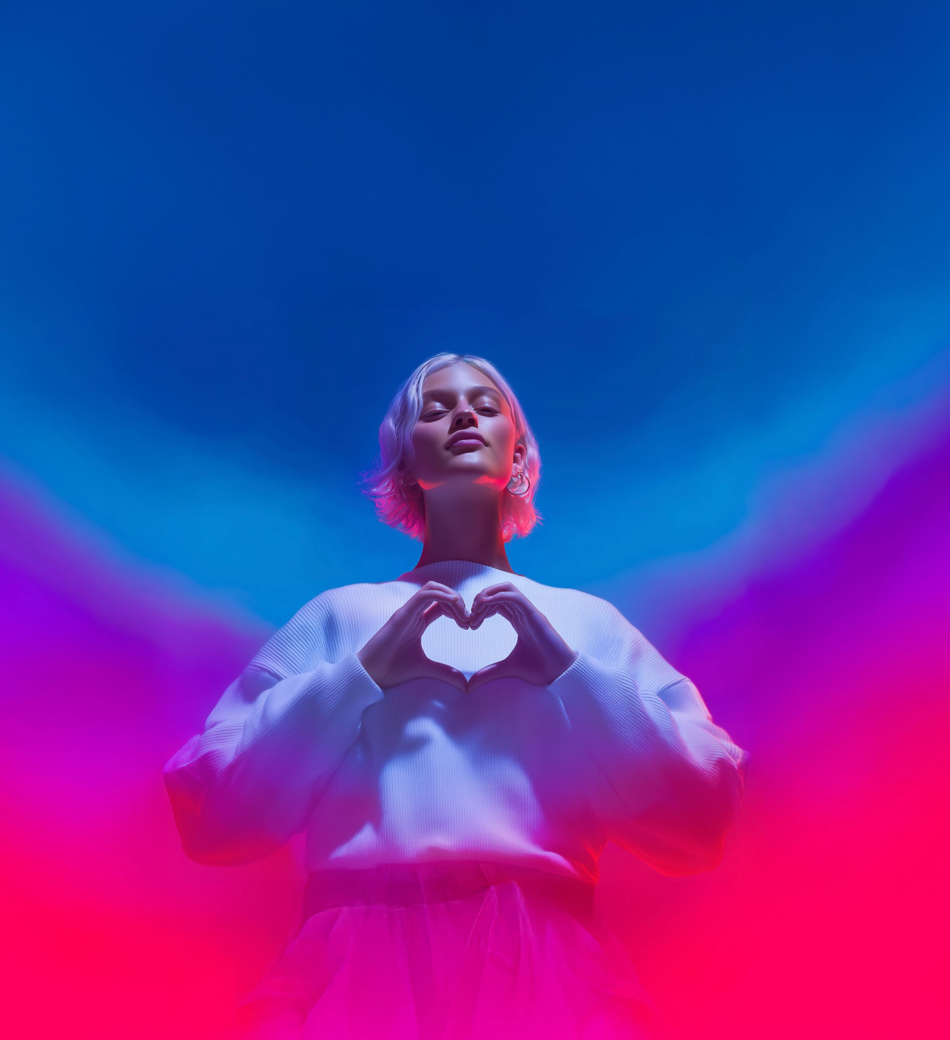 Women forming a heart with her fingers