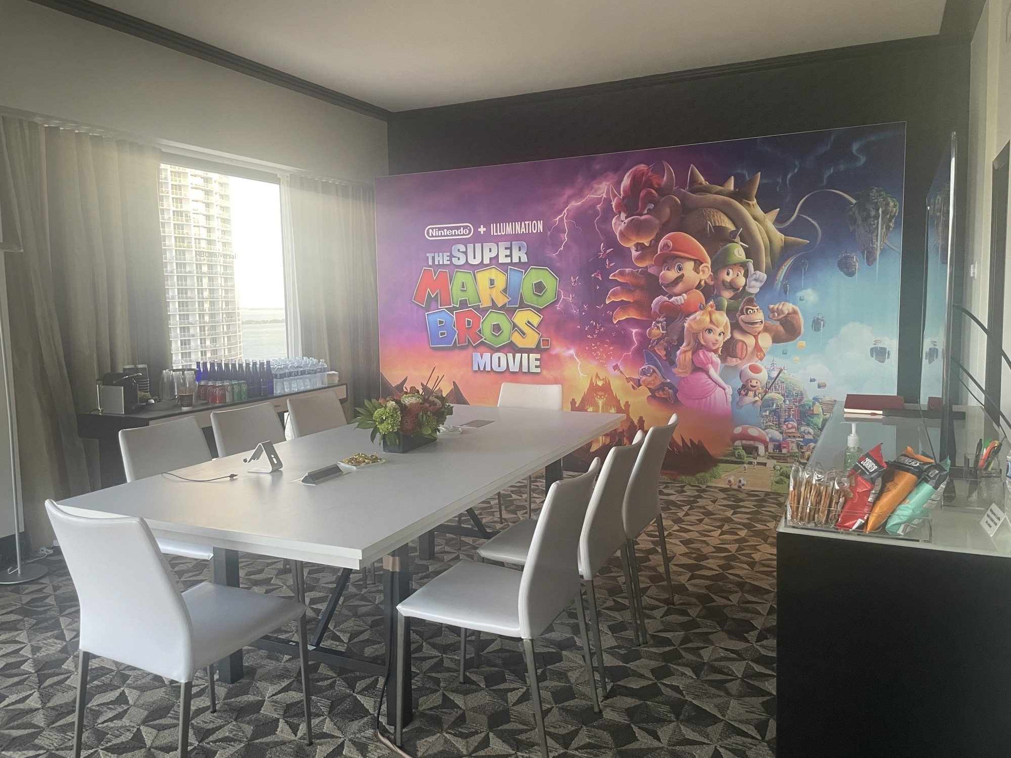 Hospitality suite dressed with Super Mario Bros. branding for client meetings or screenings.
