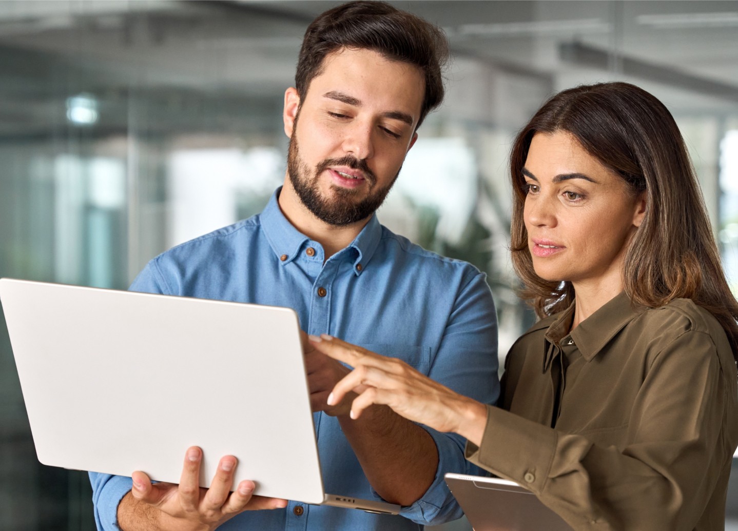 Two employees coordinating and working together using Blink Employee Self Service portal.