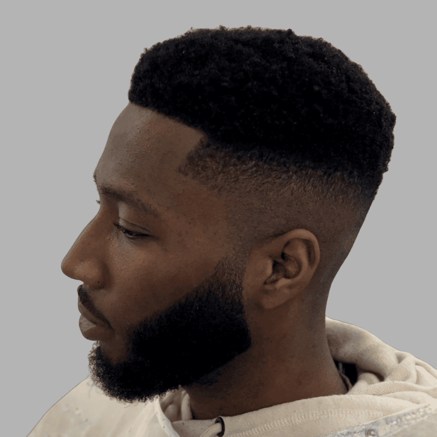 person holding white and gold hair comb