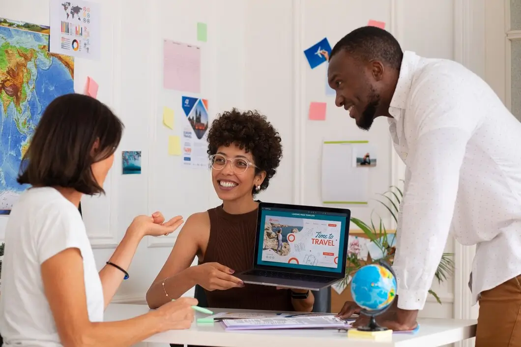  Black woman points to screen at meeting
