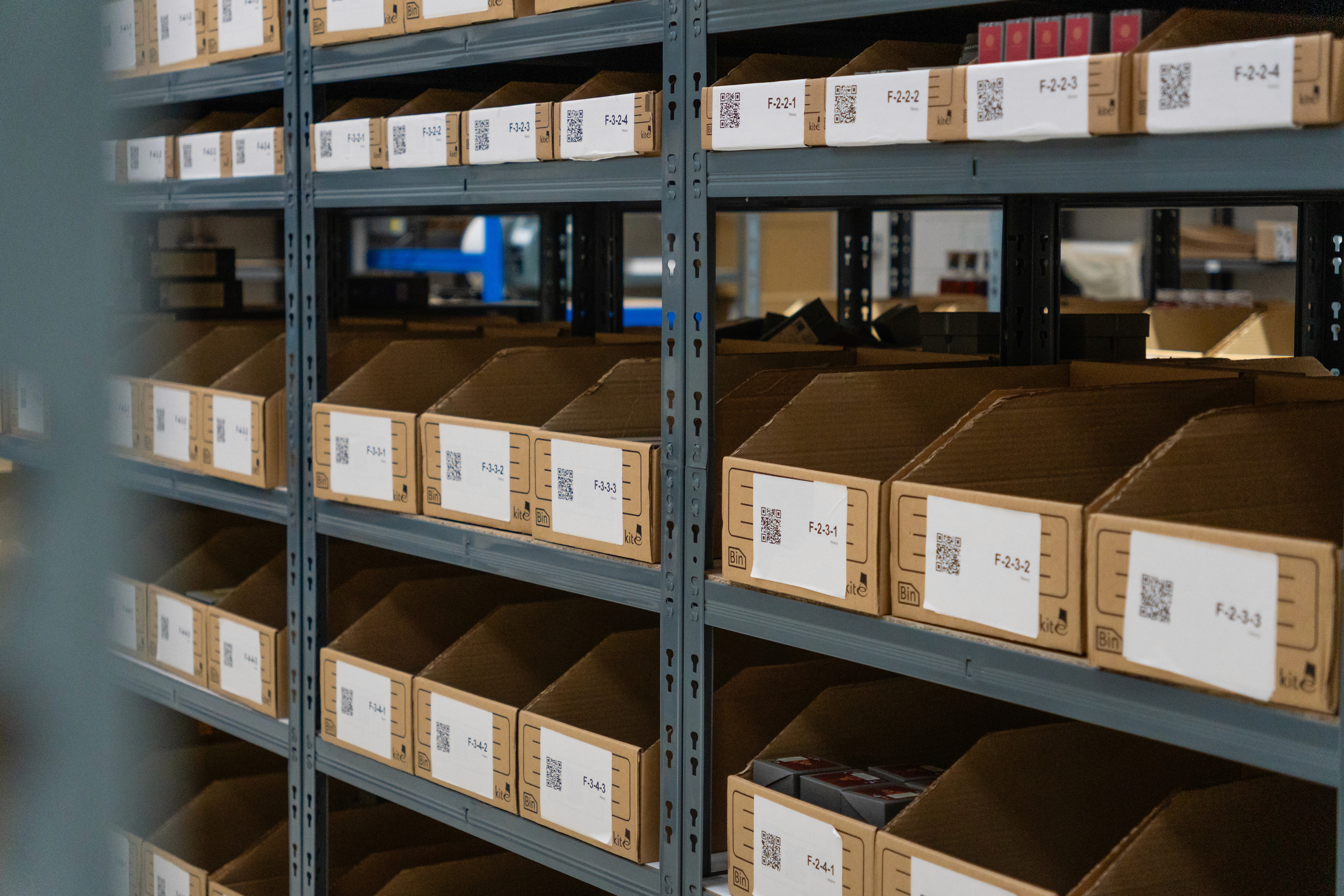 picking bins on shelves in a warehouse